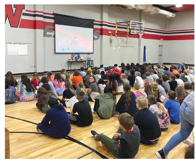Fifth grade students at East Intermediate won the fundraiser challenge and were able to watch a movie in the gymnasium.