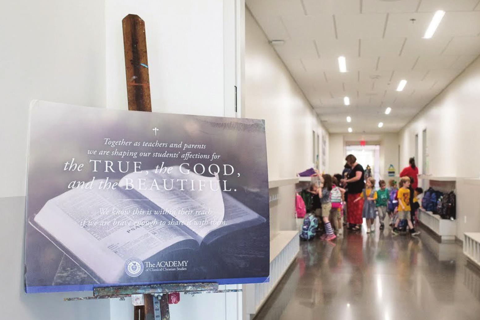 In this 2018 file photo, a sign is seen in an entryway at The Academy of Classical Christian Studies. The northeast Oklahoma City private school received $177,767 from Gov. Kevin Stitt’s federally-funded Emergency Education Relief Fund and $598,179 in federal Paycheck Protection Program loans. Whitney Bryen/Oklahoma Watch