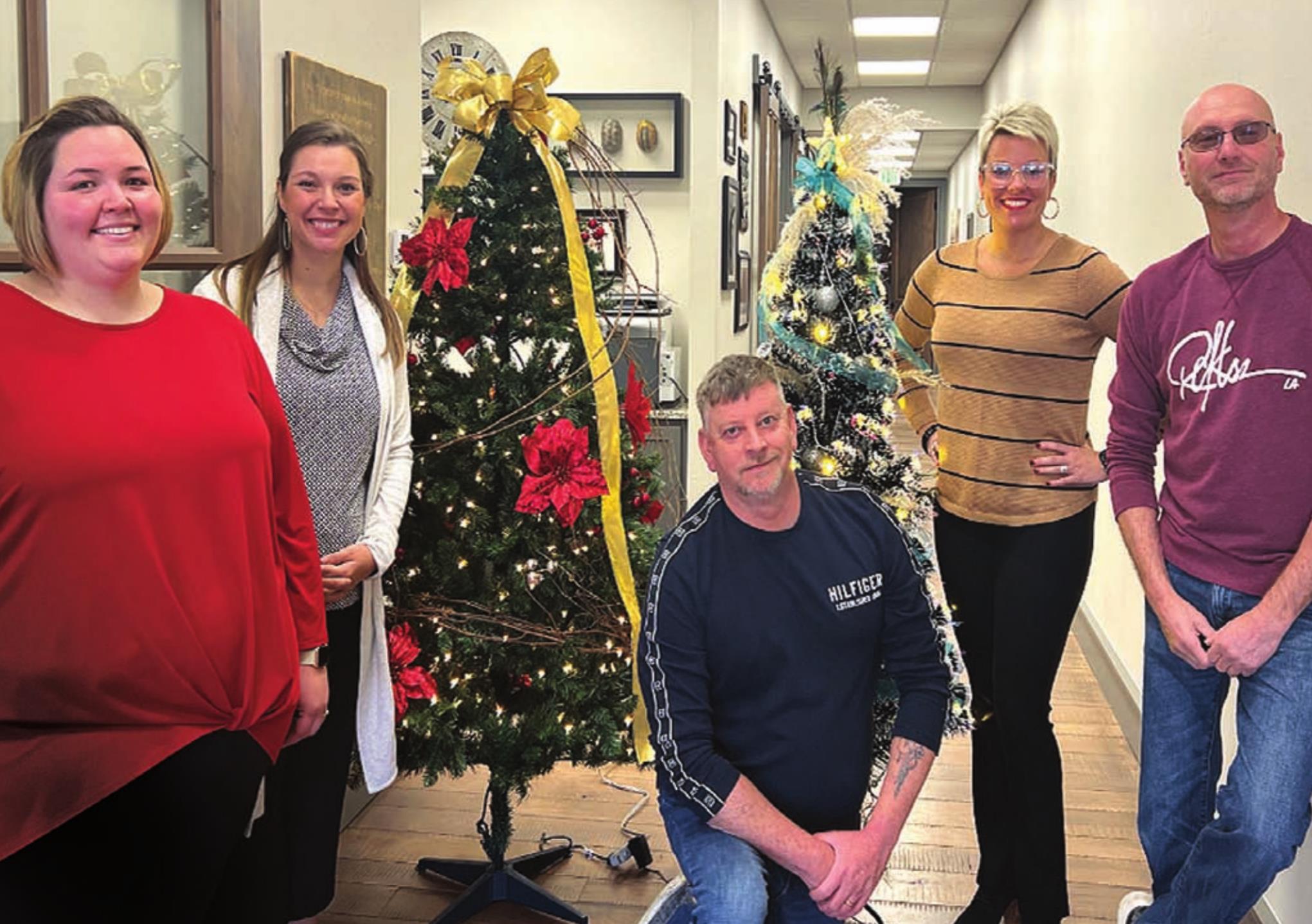 The Weatherford Regional Hospital Foundation accepted Christmas trees to be on display at the hospital from Kings Flowers and Gifts. From left are Katherine Smith, Jenna Leven, Roger Blackshear, Katie Bartmann and Mark Musick.