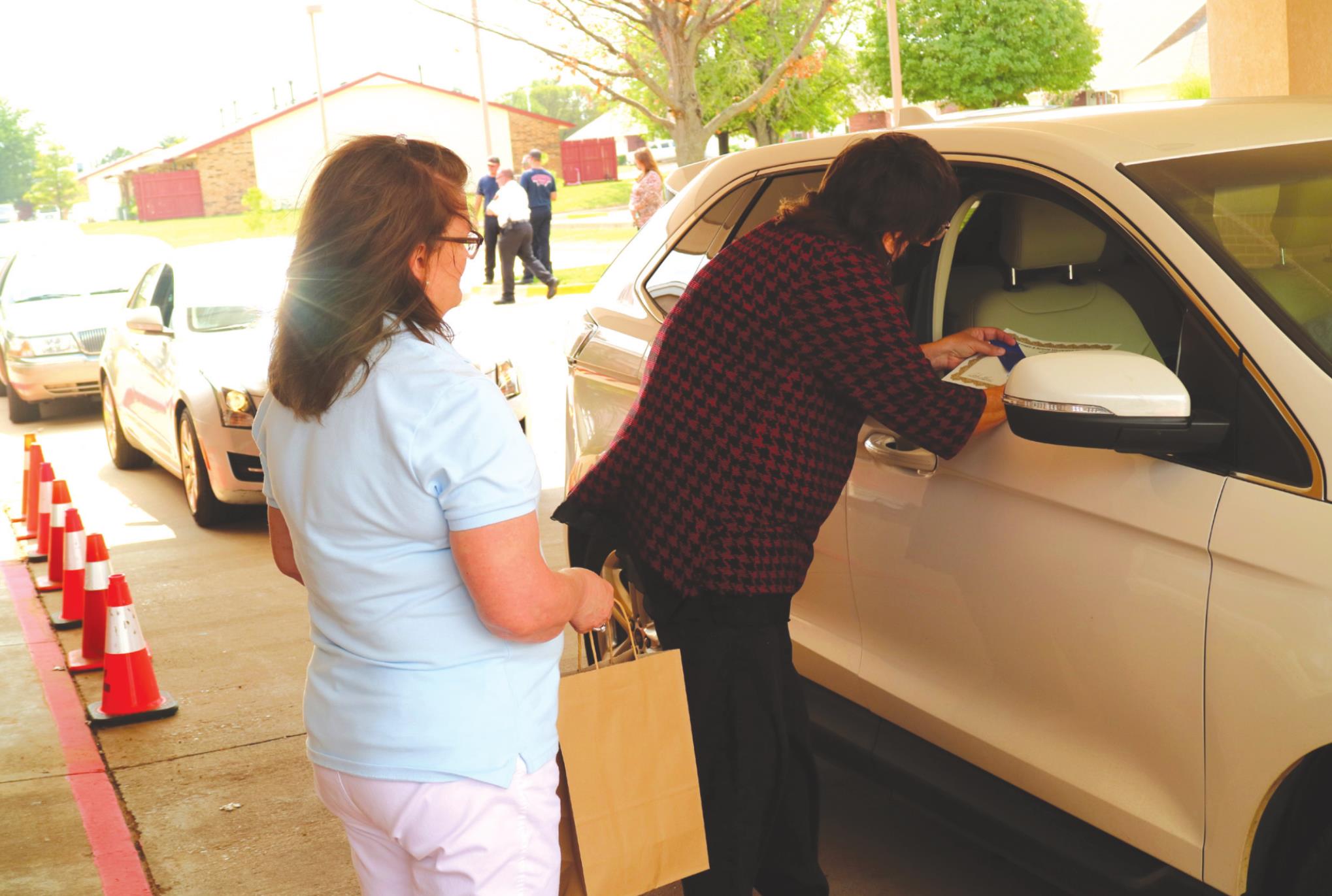 Pionner Center Volunteers distribute meals to local seniors earlier this year. The drive-thru service will continue througout the winter months. CADC Nutrition will consider reopening the dining room in the spring. File Photo