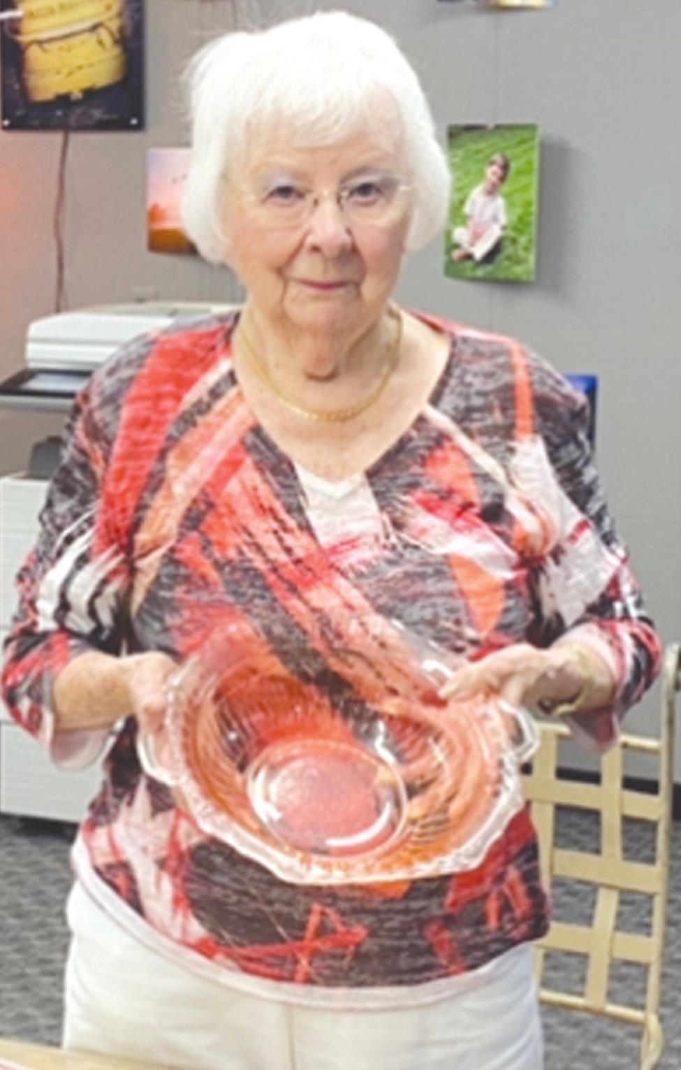 Josh Jennings/WDN Evelyn Hart holds a piece of Depression glass, which she has been collecting since the 1930s.