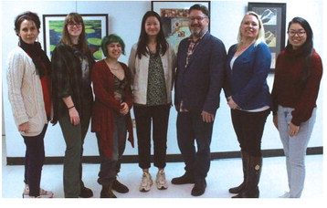 Glenda Ross, Madi Giffin, Makayla Vasquez, Ivy Milsap, Todd Parker, Angela Keeler and Maggie Tran pose for a picture Thursday evening. These and two other artists have their work on display now through December 16. Kimberly Lippencott/WDN