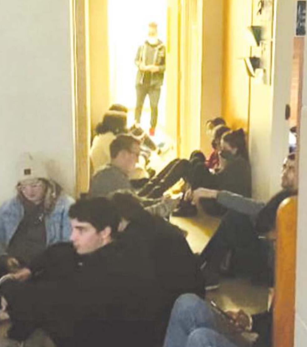 Students take cover after getting alerted of an active shooter near Southwestern Oklahoma State University campus. The alleged suspect is Kingsley Ehiemua, inset in the above picture at left. Courtesy of Johannes Becht