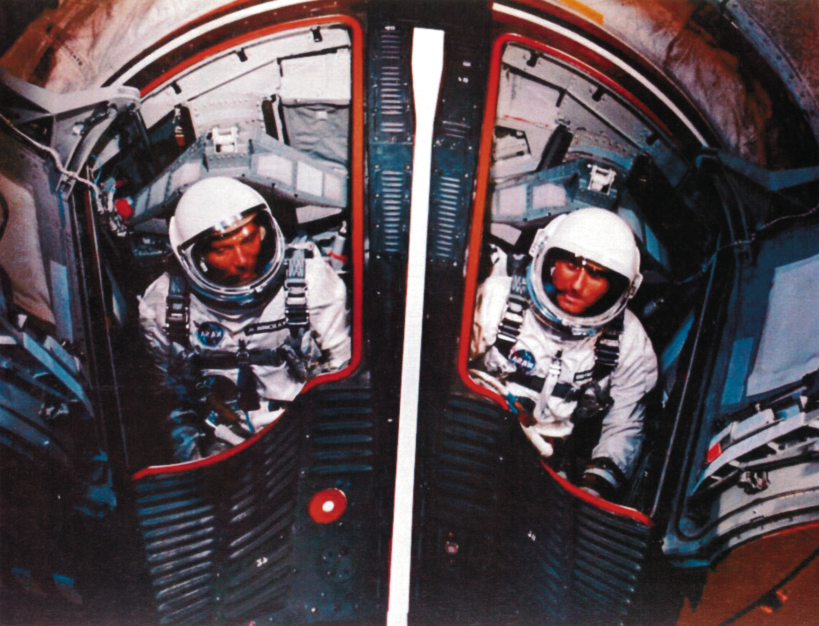 Astronaut Walter Schirra, commander of the backup team for the first Gemini flight and Major Tom Stafford, right, wait in the capsule prior to the Gemini 6 launch.