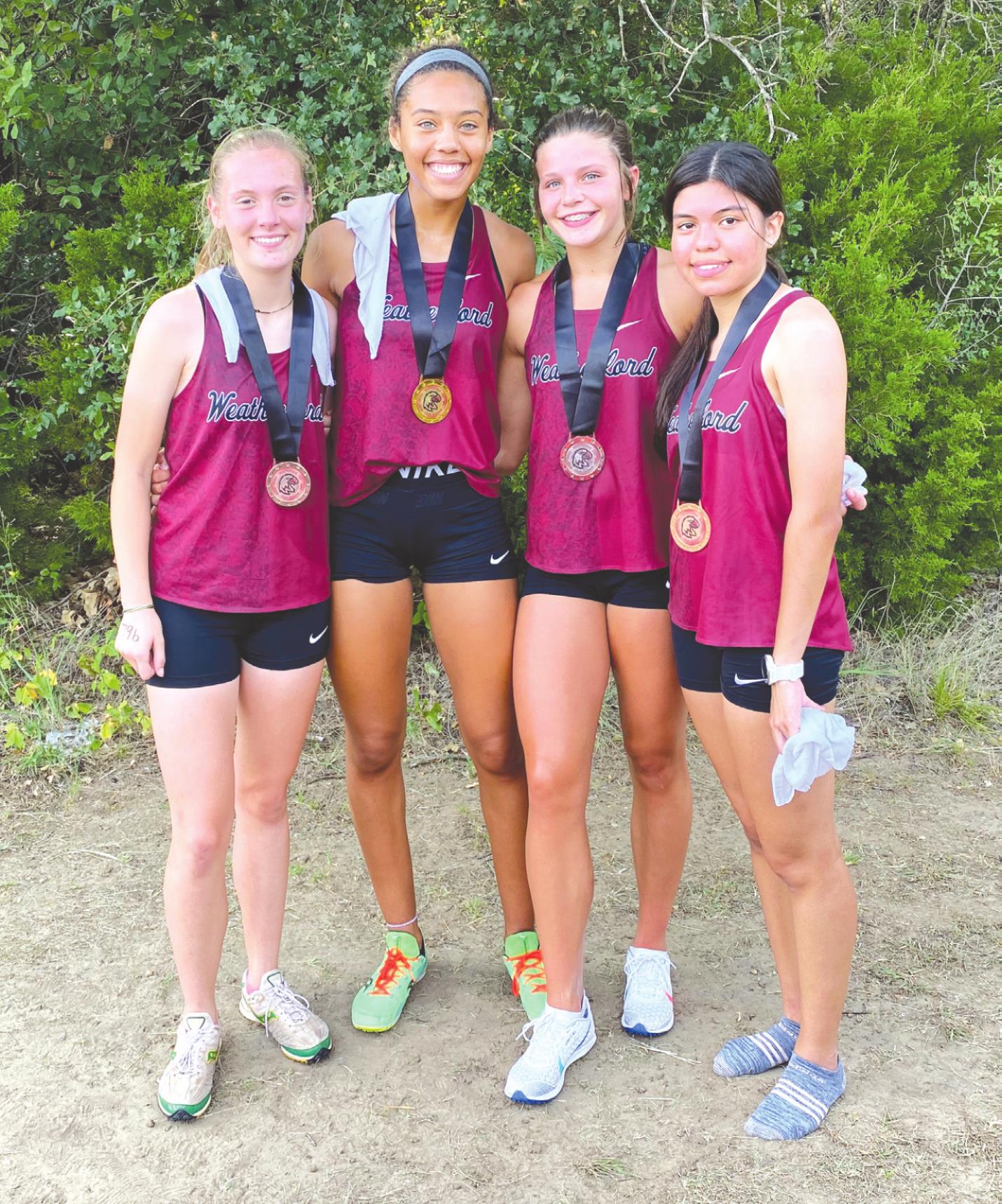 From left is Morgan Mouse, Kennadi Price, Jordan Hoffman and Ana Arrieta all placed inside the top 30 at the Watonga Cross Country meet Saturday. Josh Jennings/WDN