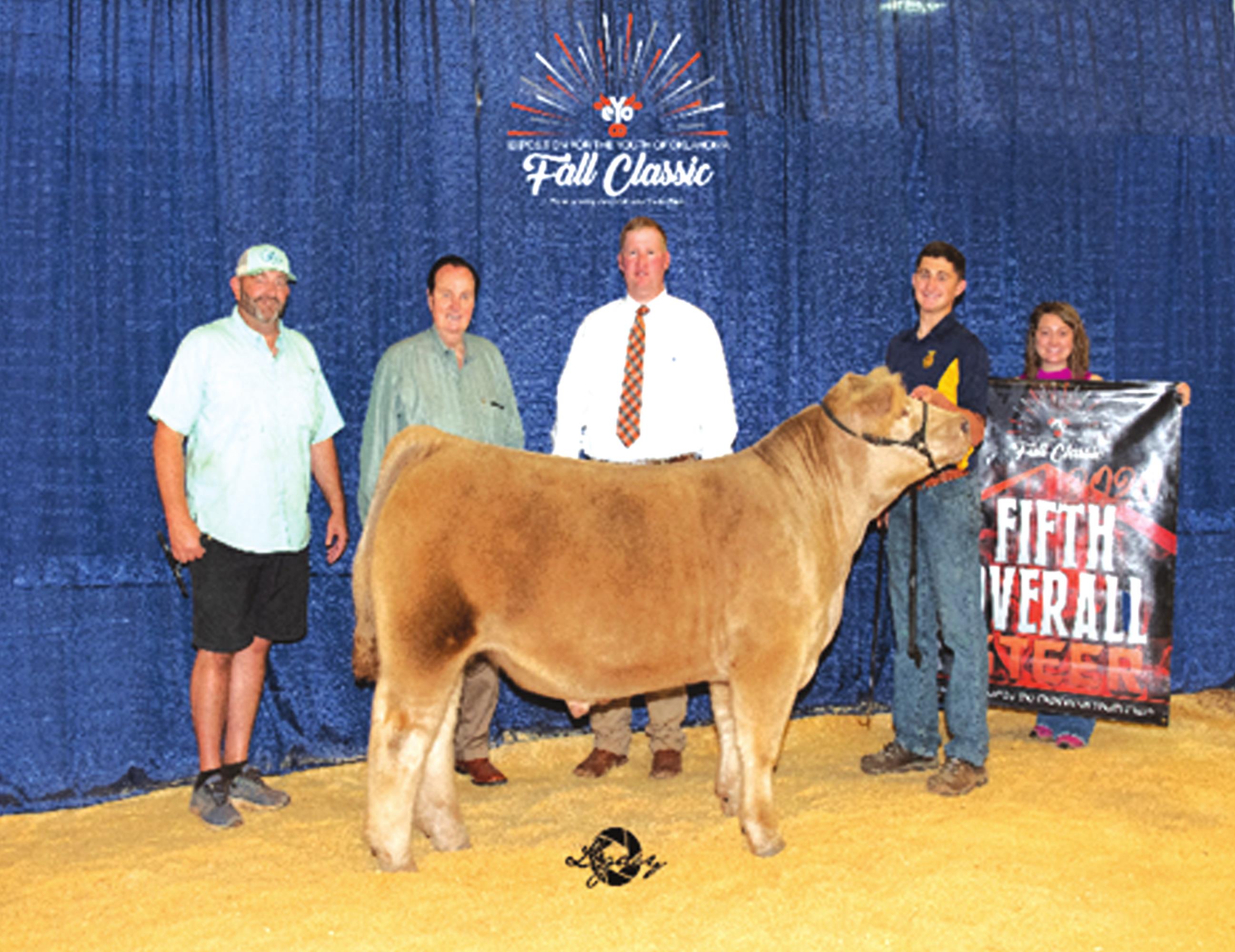 Grady Chaplin, second from right, is seen with his steer who placed fifth overall at the Exhibition of Youth Oklahoma Fall Classic Show. Provided