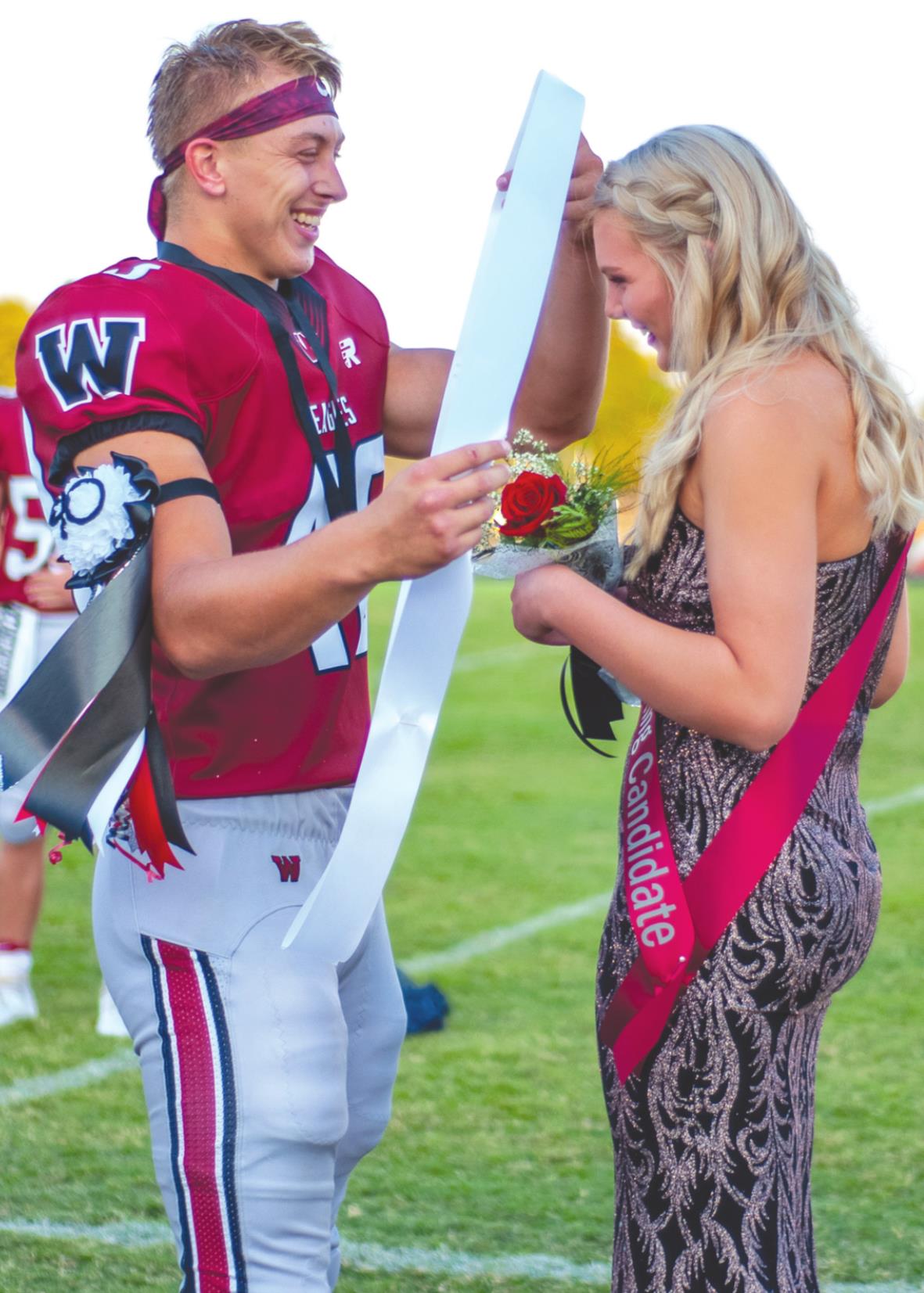 Ethan Downs places the Homecoming Queen sash around Caroline Whitefield’s neck during the coronation before Weatherford’s game against Newcastle. Downs was named Homecoming King and Whitefield Homecoming Queen. Danny Ediger Jr./WDN