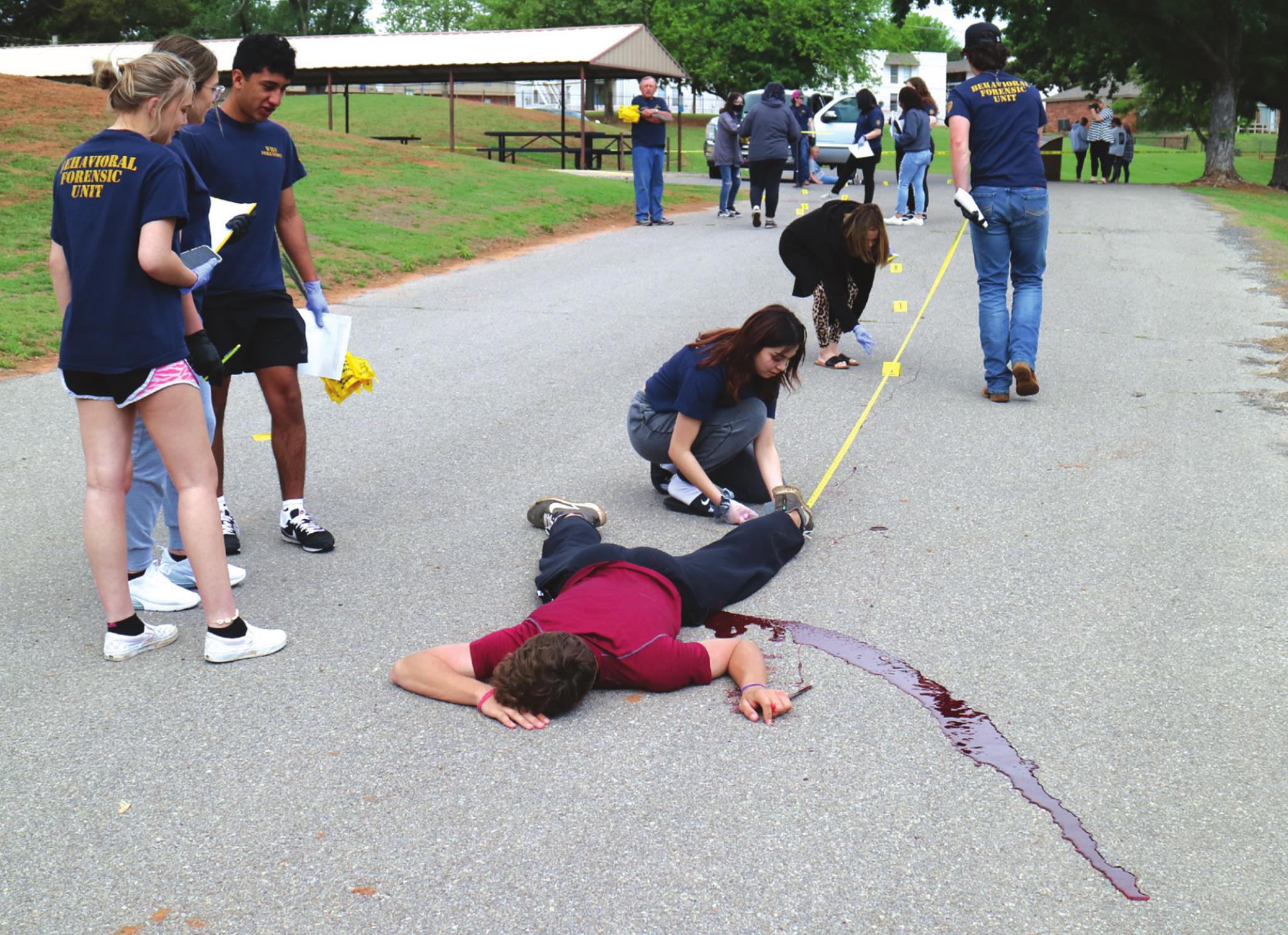 Weatherford high school forensics students are analyzing a mock crime scene. Students made measurements to locate the distance between the victim and the evidence. Montgomery Malone/WDN