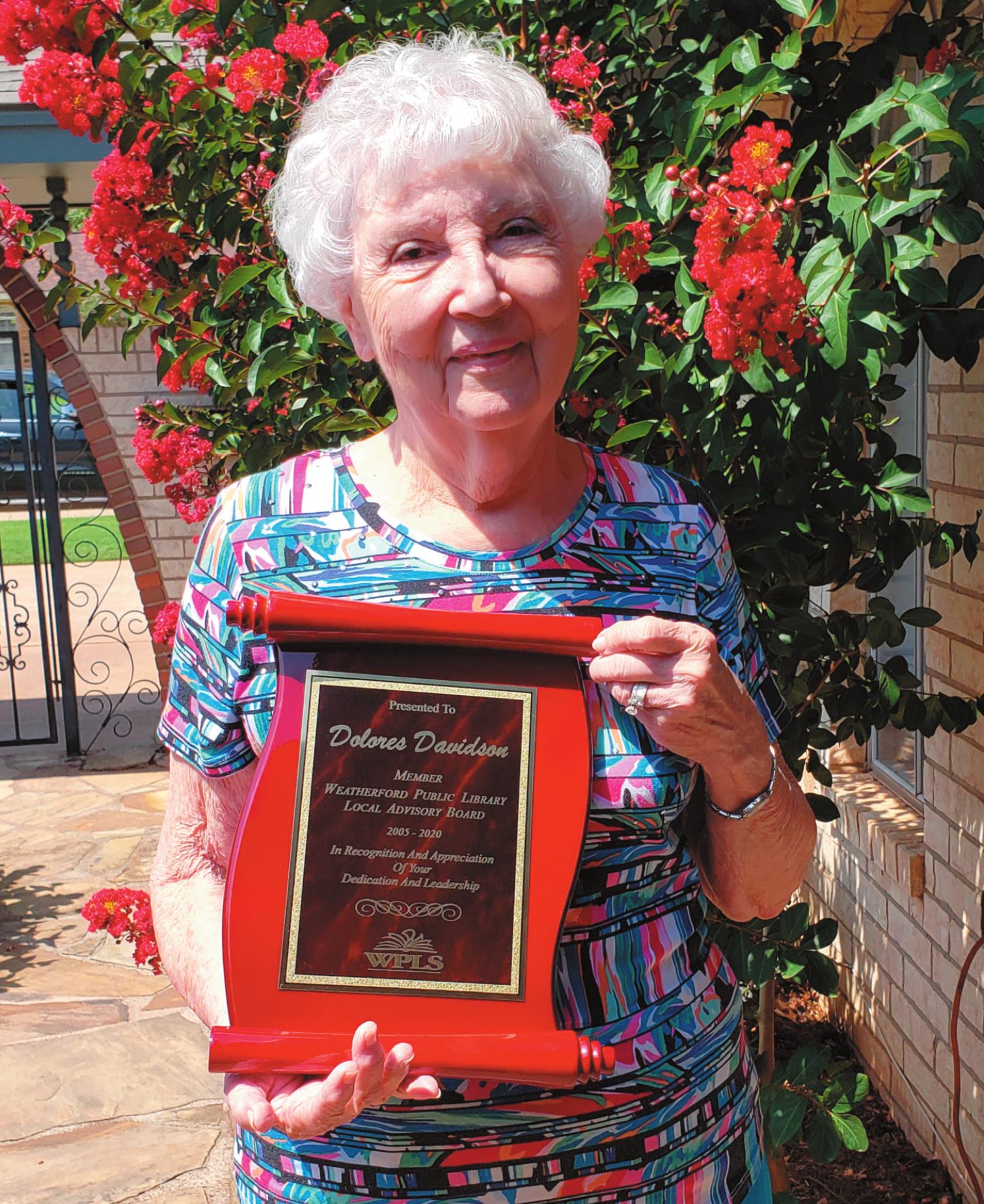 Leanna Cook/WDN Dolores Davidson shows off the plaque commemorating her service with the Weatherford Public Library Local Advisory Board.