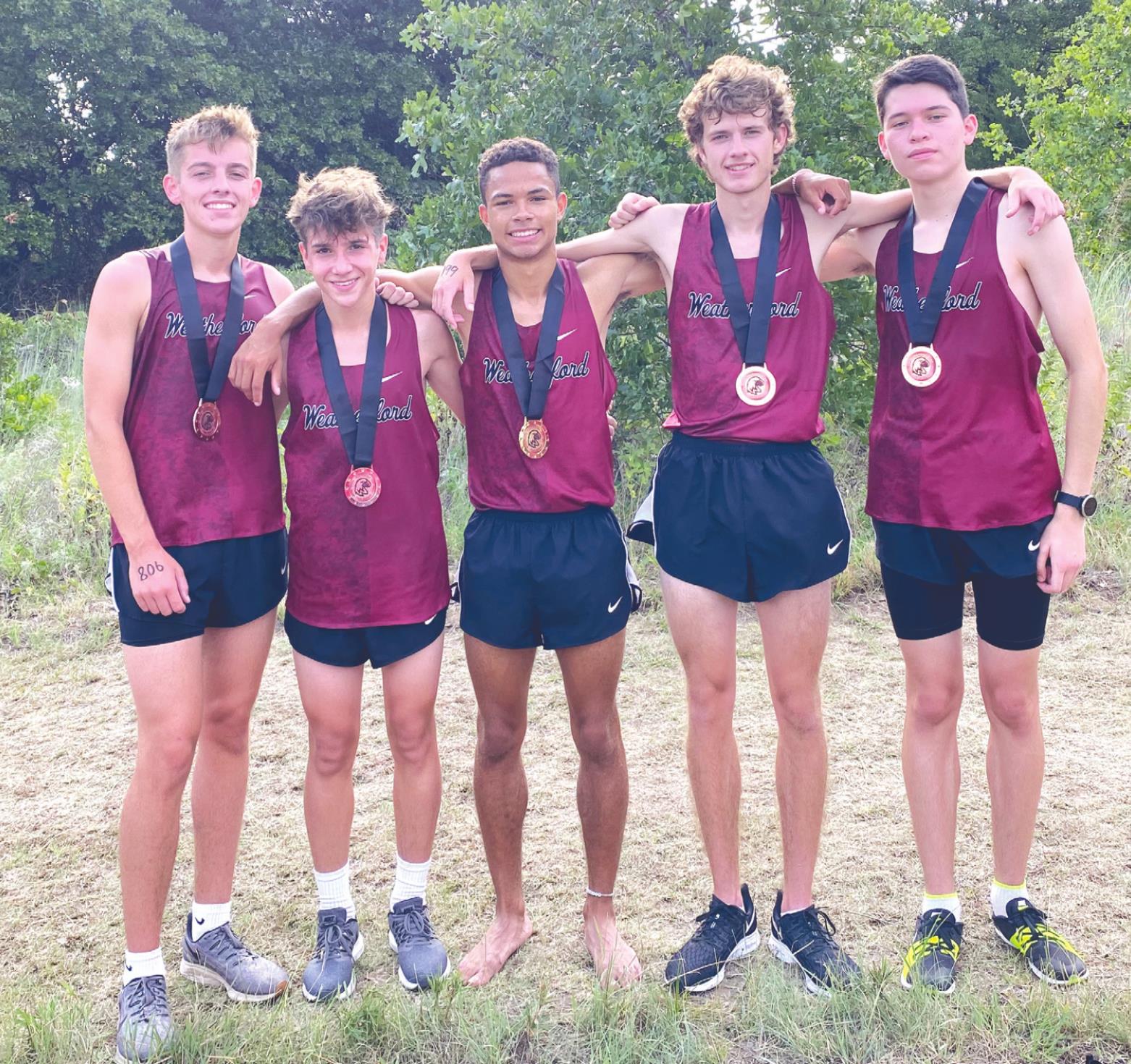 At right, AJ Stevenson, left, Jacoby Welsh, Garry Rose, Grant Christian and Alberto Arrieta all placed inside the Top 25 at the Watonga cross country meet Saturday. Josh Jennings/WDN