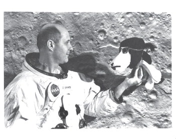 May 29, 1969 SNOOPY PROUD: Gen. Tom Stafford holds up a stuffed Snoopy, which crew members nicknamed Apollo 10. ►