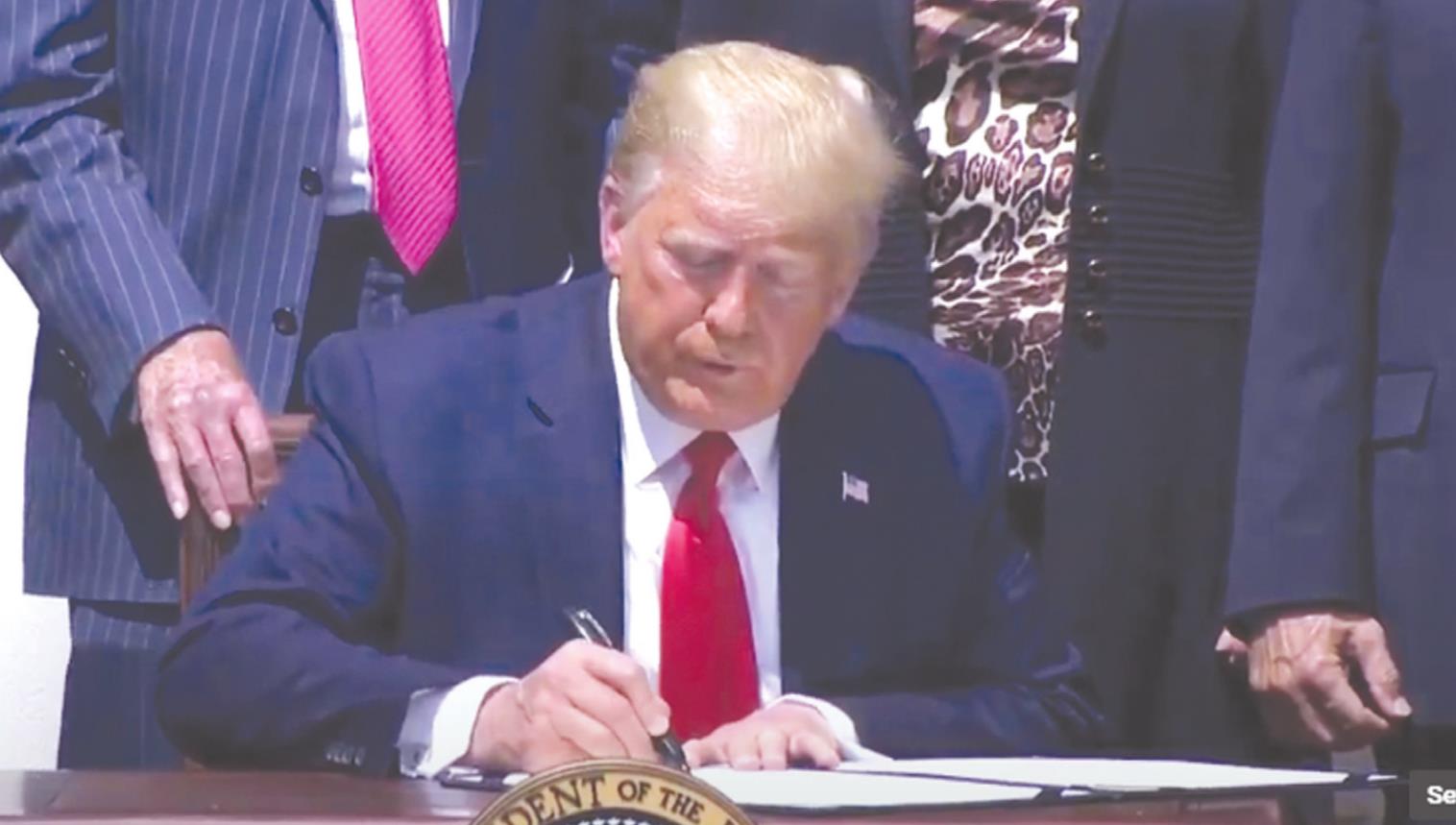 President Donald Trump signs H.R. 7010 Friday morning, which will make changes to existing legislation.Provided