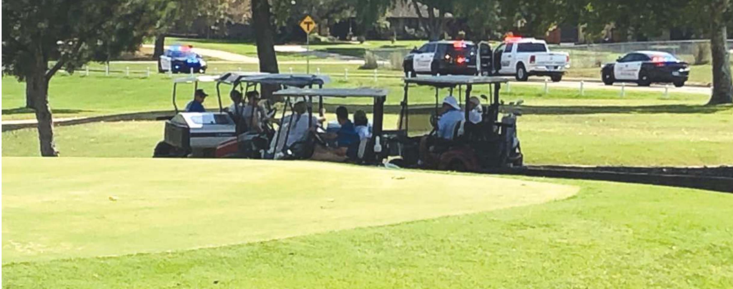 Provided Golfers watch as a police chase ends near Prairie West Golf Club Friday afternoon.