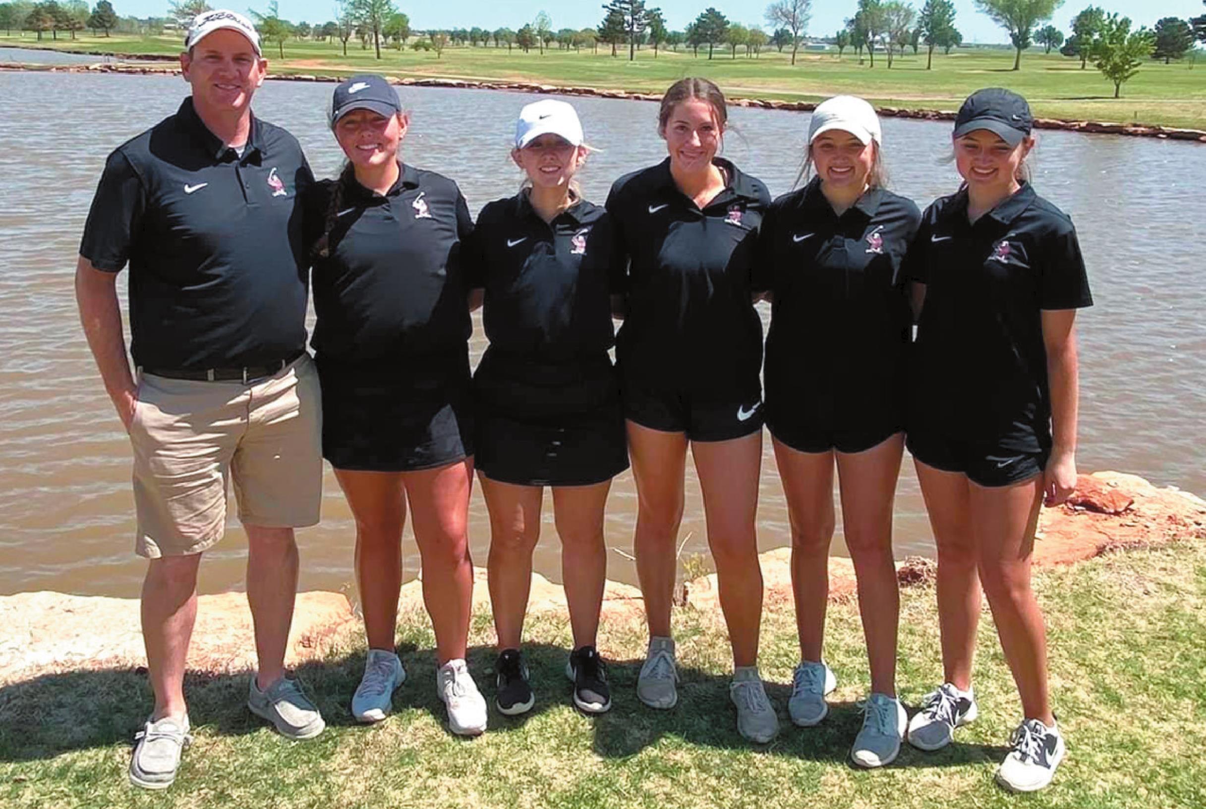 Coach Kyle Mickley, left, is pictured with the Weatherford girls golf team. Team members are, from left, Chloe Cummins, Rachel Carruth, Maddy Hada, Addison Elwick and McKinley Elwick. The team finished second at the regional tournament in Kingfisher. Josh Jennings/WDN