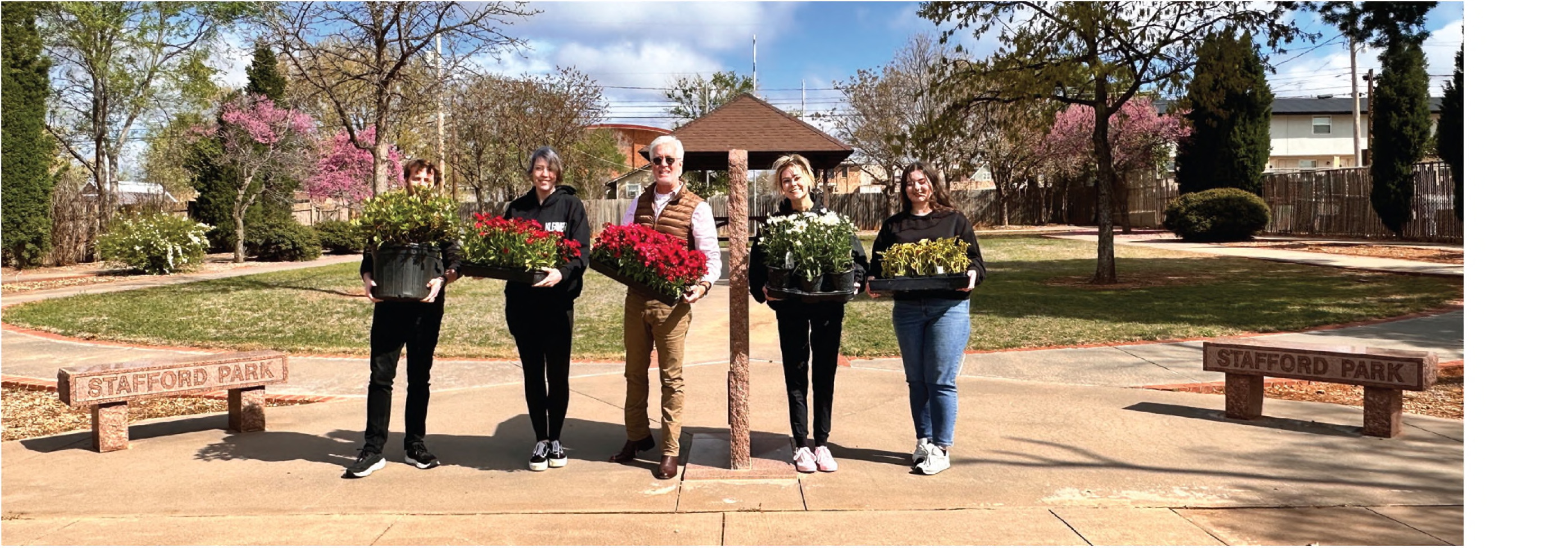 ► The Weatherford Daily News staff plants flowers at Stafford Park as a salute to the late Lt. Gen. Thomas P. Stafford in preparation for the funeral Friday. Pictured are John Cook, far left, Sarah Cook, WDN Publisher Phillip Reid, Camryn Henderson and Kyra Huckabay.