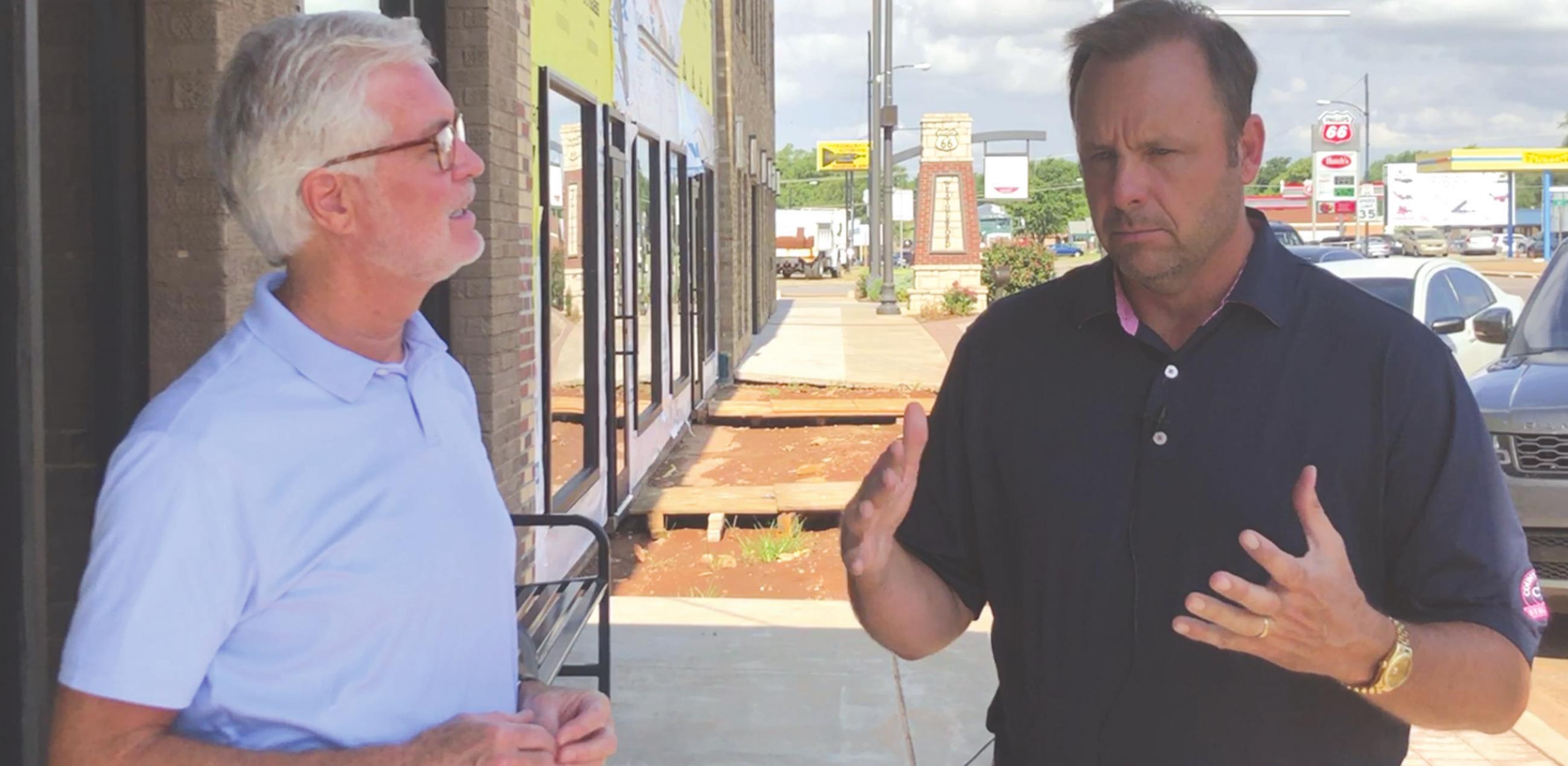 Bob Bartmann, right, speaks with Weatherford Daily News Publisher Phillip Reid about the ongoing renovations at 212 and 214 W. Main St. in Towne Centre.