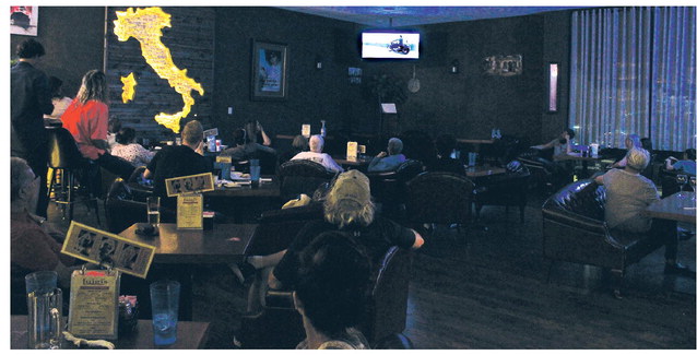The OETA hosted a special premiere showing off their new episode featuring Bobby Cornelsen and moments of his life. Pictured left, from left, is Robert Reid, Bobby Cornelsen, Lyndsie Beesley and Jarred Smith. Pictured below are friends, family and community members watching the episode Wednesday night at Luigi’s. See more photos on page 6. Kiersten Stone/WDN