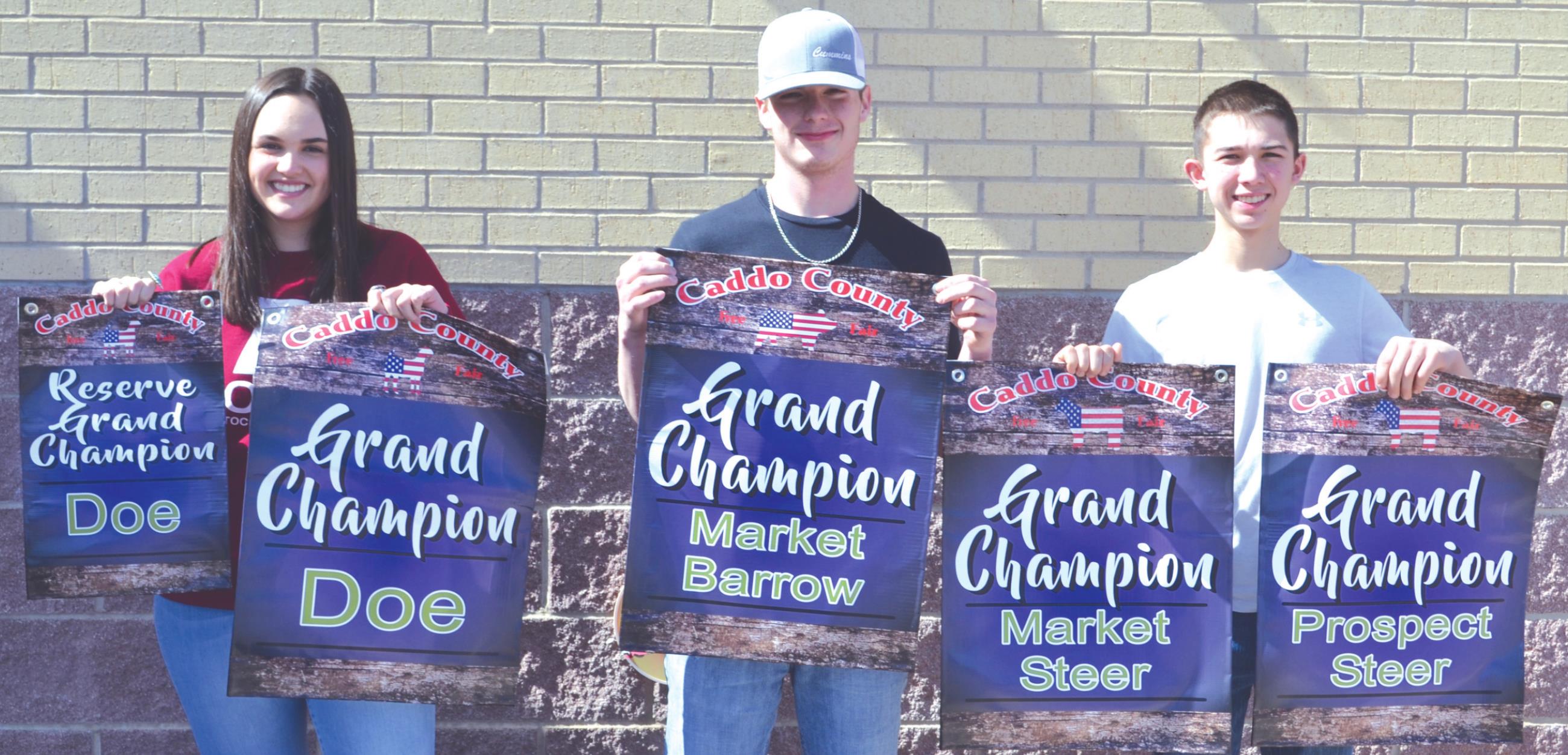 Tabrey Lierle, Cade Rea and Rider Klaassen show off their awards from the Caddo County Livestock Show this week. Provided