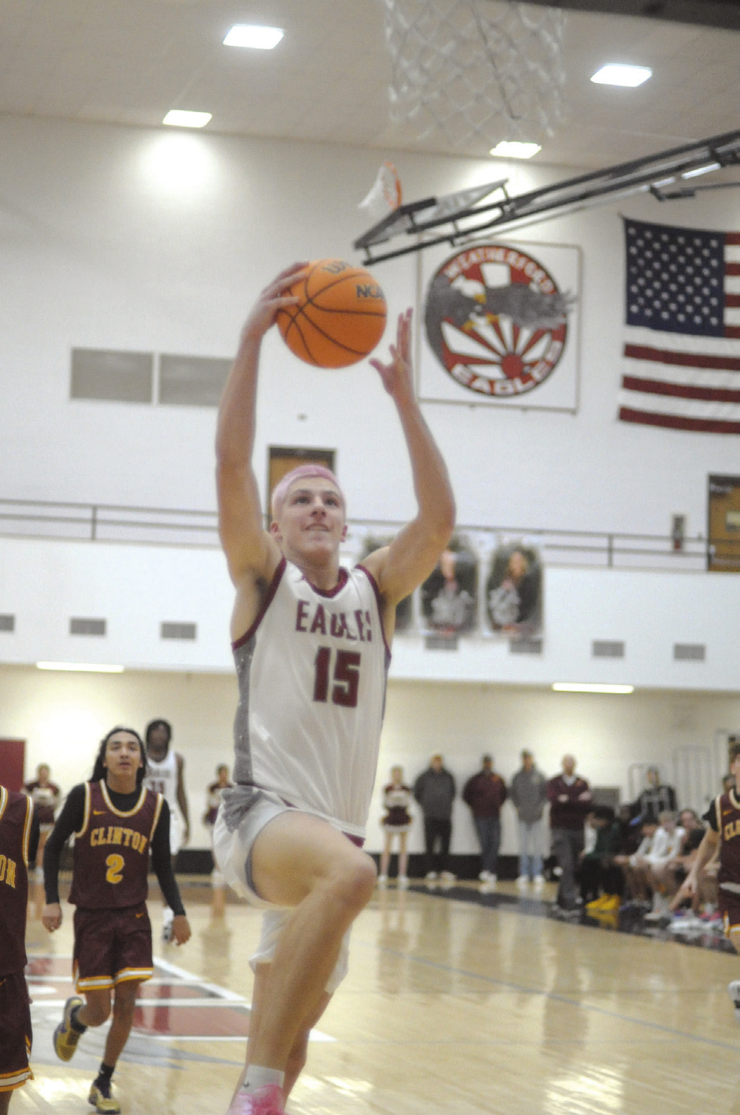 Nate Reherman goes up for a dunk during Tueday’s game against Clinton. He scored 26 points, which was more than Clinton did in the entire game. Josh Burton/WDN