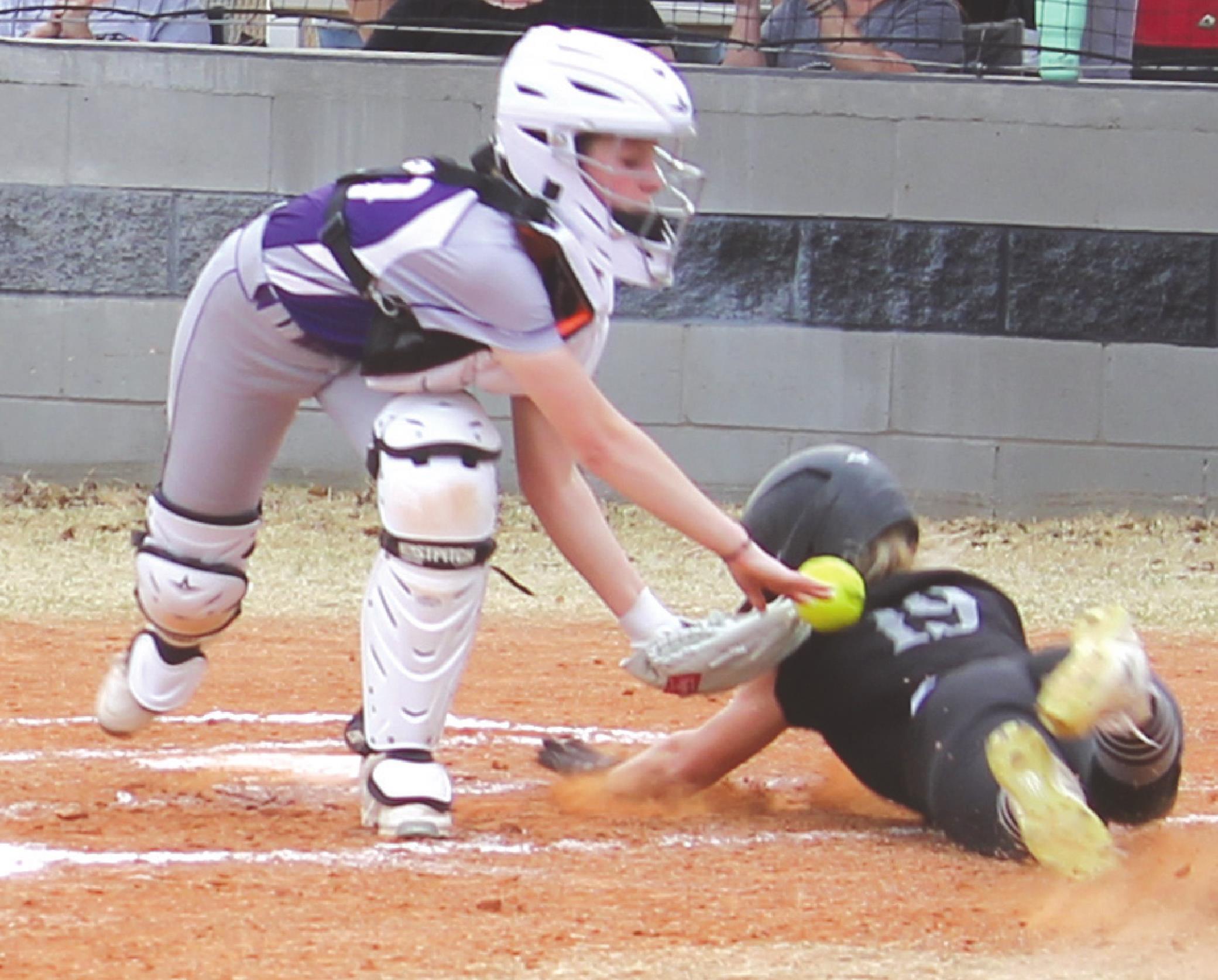 Jaysa Slagell, left, tries to tag out a Lookeba-Sickles baserunner. Josh Jennings/WDN