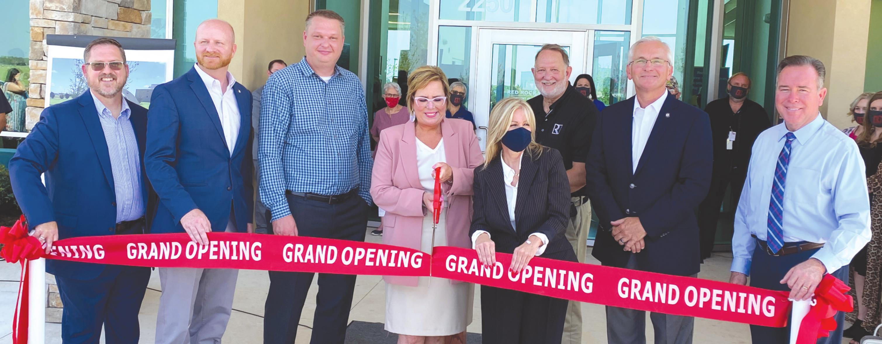 CEO Verna Foust, center, cuts the ribbon for Red Rock Behavorial Health Services as they celebrate their grand opening ribbon cutting Friday for their new facility. From left are Jason Cornelius, Sen. Brent Howard, Kile Kuykendall, Foust, Carrie Slatton-Hodges, Sen. Darcy Jech and Rep. Todd Russ. Phillip Reid/WDN