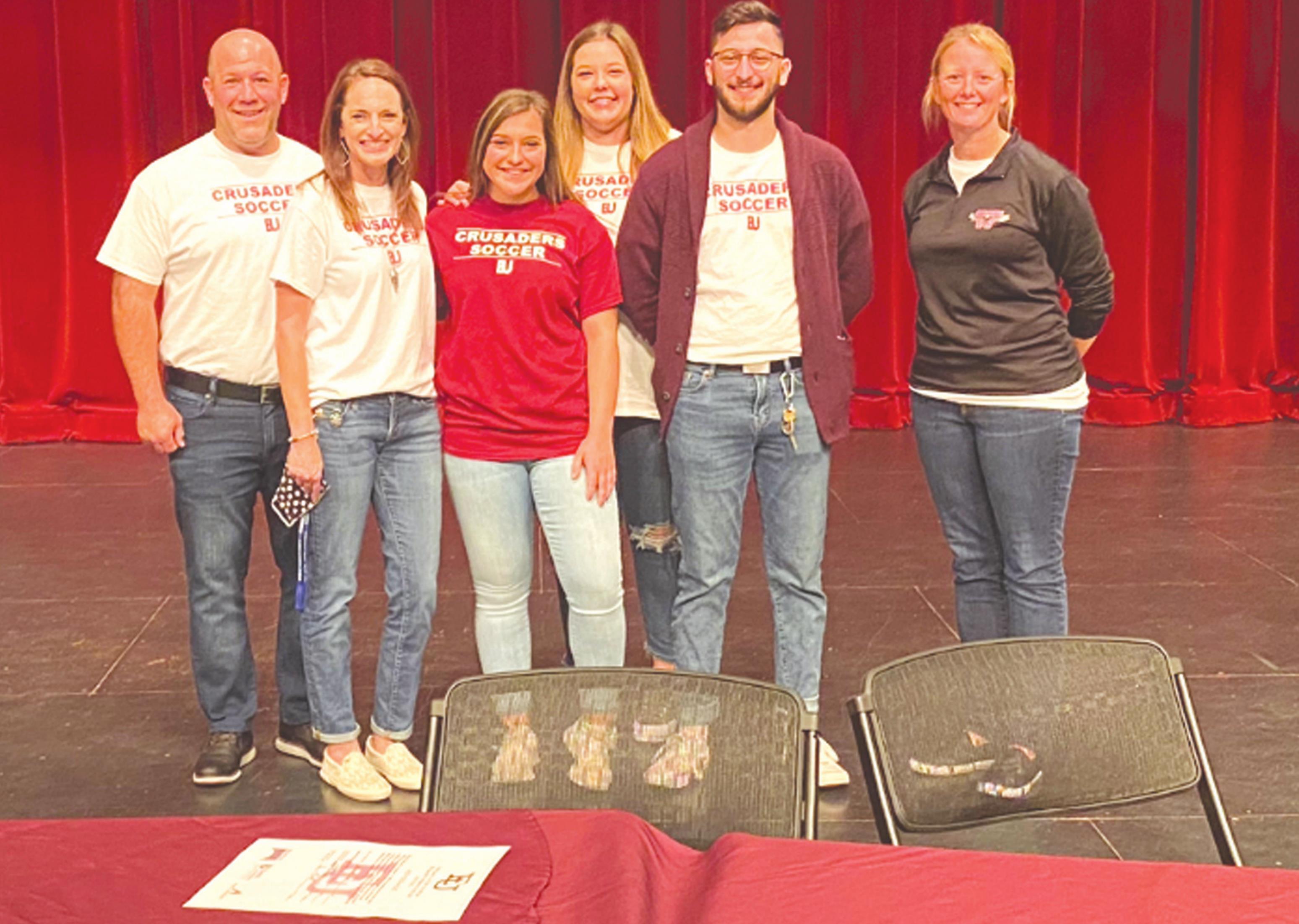 Above, Weatherford senior soccer player Addy Hicks signed to play college soccer at Evangel University in Springfield, Missouri. Pictured, from left are her parents, Nate and Jolie Hicks, her siblings, Brooklyn and Dylon Hicks, and head coach, Delydia Givens. Josh Jennings/WDN