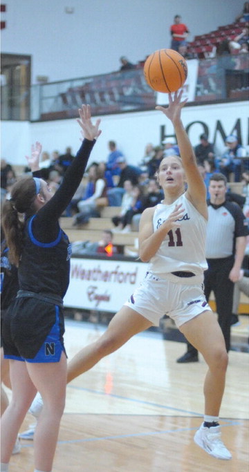 ► Marley Teasley puts up a contested shot. She scored 17 points in the game.