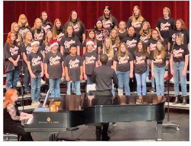 The 7th and 8th grade choir performs during their winter concert Sunday night in the Performing Arts Center. Provided