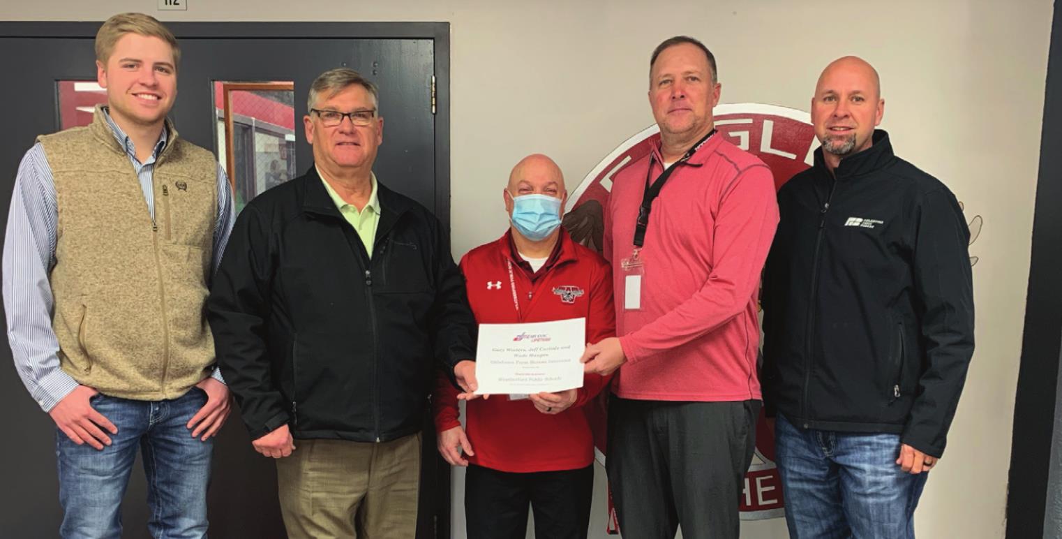 Farm Bureau Insurance Agents Jeff Carlisle, Gary Winters and Wade Haugen are seen with staff from Weatherford Public Schools for a new Air Evac program. Provided