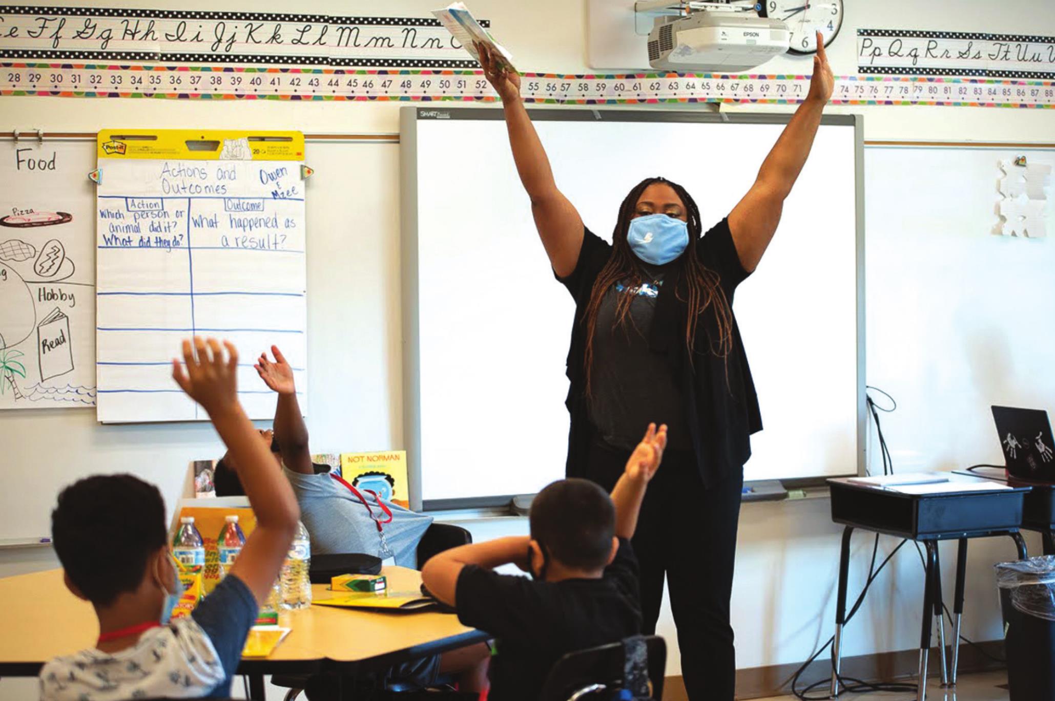 Quanetta Broom, a school counselor at Cesar Chavez Elementary School in Oklahoma City, asks second graders to raise their hands if they’re having a good day after learning about Whitney Bryen/Oklahoma Watch