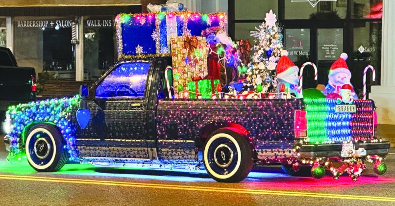 Members of the Heartland Car Cruise decorate their during the Hometown Christmas in Towne Centre Tuesday. Tyler Bryson/WDN