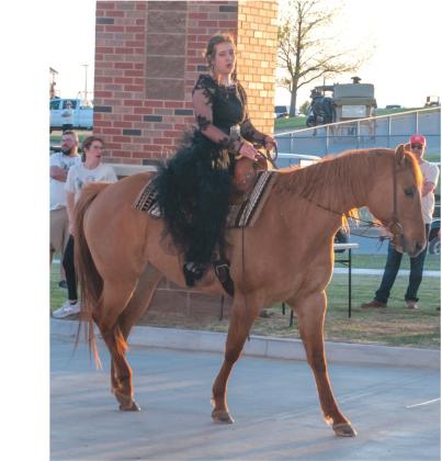 Myka Taggart arrives at Weatherford High School’s Prom on a horse. She had the most original drop-off during the promenade before the festivities. Danny Ediger Jr.AA/DN