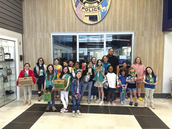 Girl Scouts from Weatherford troop 827 donated cookies to local first responders at the Weatherford Police Department, hospital and Air Evac. Pictured above is the donation to the Weatherford Police Department.
