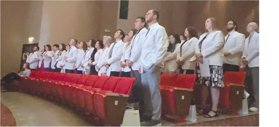► Tyler Bryson/WDN SWOSU pharmacy students take the Oath of the Pharmacist during Saturday’s White Coat Ceremony ahead of Friday, May 3’s, commencement ceremony.